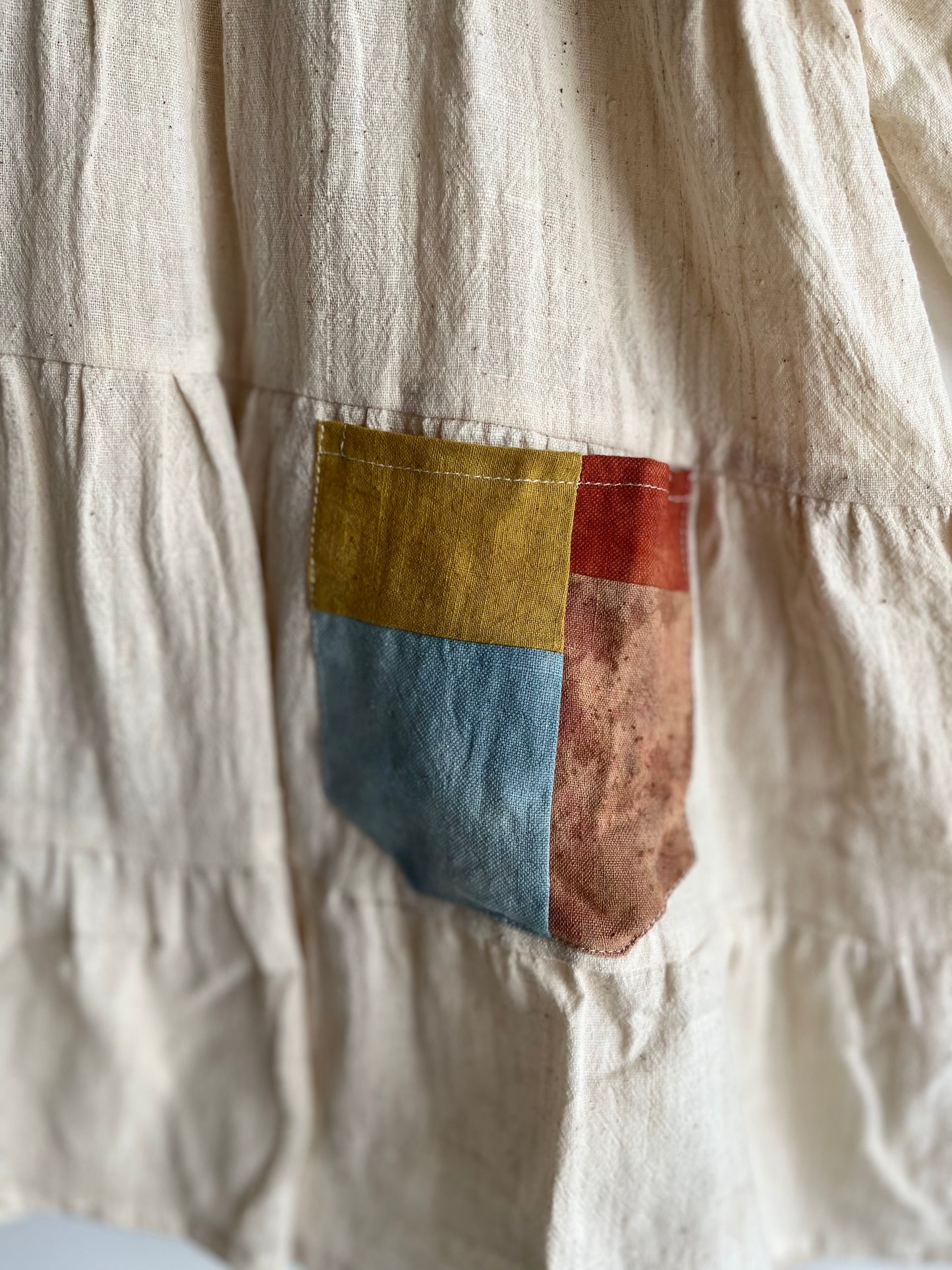 White tier patch pocket frock