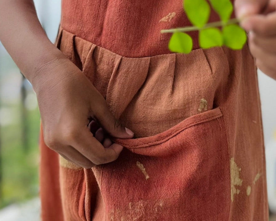 Kid in natural dyed romper